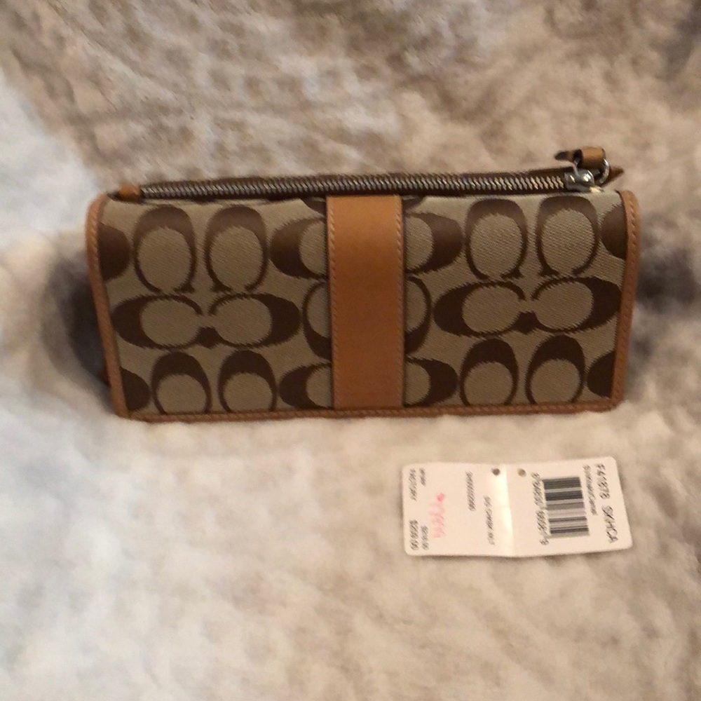 Beautiful new Coach wallet with check book holder